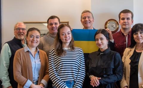 Members of a Ukrainian delegation pose with UNE President James Herbert and Associate Provost Mike Sheldon